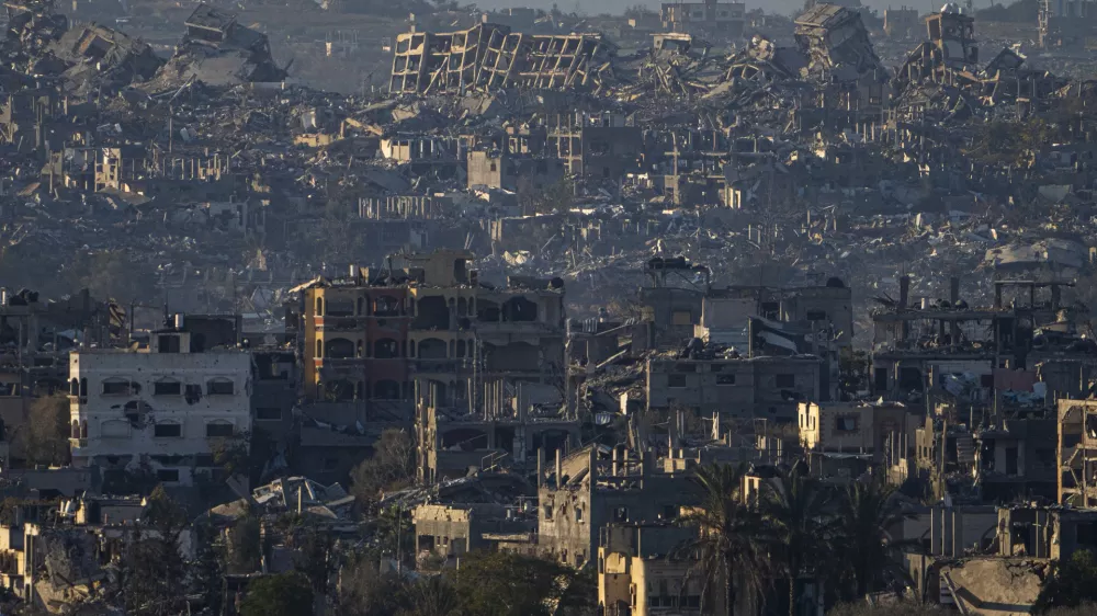 FILE - Destroyed buildings are seen inside the Gaza Strip from southern Israel, Jan. 13, 2025. (AP Photo/Ariel Schalit, File)