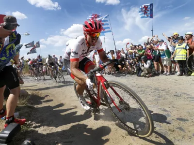 dpatop - German John Degenkolb of Trek-Segafredo traverses cobblestones during stage nine of the 105th edition of the Tour de France cycling race, from Arras Citadelle to Roubaix, in France, 15 July 2018. Photo: Yuzuru Sunada/BELGA/dpa