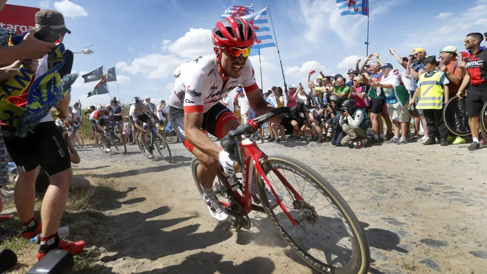 dpatop - German John Degenkolb of Trek-Segafredo traverses cobblestones during stage nine of the 105th edition of the Tour de France cycling race, from Arras Citadelle to Roubaix, in France, 15 July 2018. Photo: Yuzuru Sunada/BELGA/dpa
