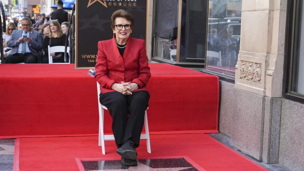 Billie Jean King poses with her new star at a ceremony on the Hollywood Walk of Fame on Monday, April 7, 2025, in Los Angeles. (AP Photo/Chris Pizzello)