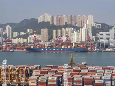 Container ships are docked at Kwai Chung Container terminal in Hong Kong, Tuesday, Apr. 8, 2025. (AP Photo/Chan Long Hei)