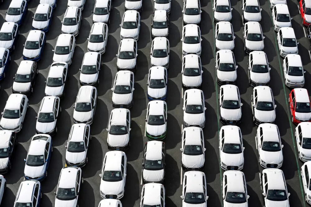 FILE PHOTO: Volkswagen export cars are seen in the port of Emden, beside the VW plant, Germany March 9, 2018. REUTERS/Fabian Bimmer/File Photo