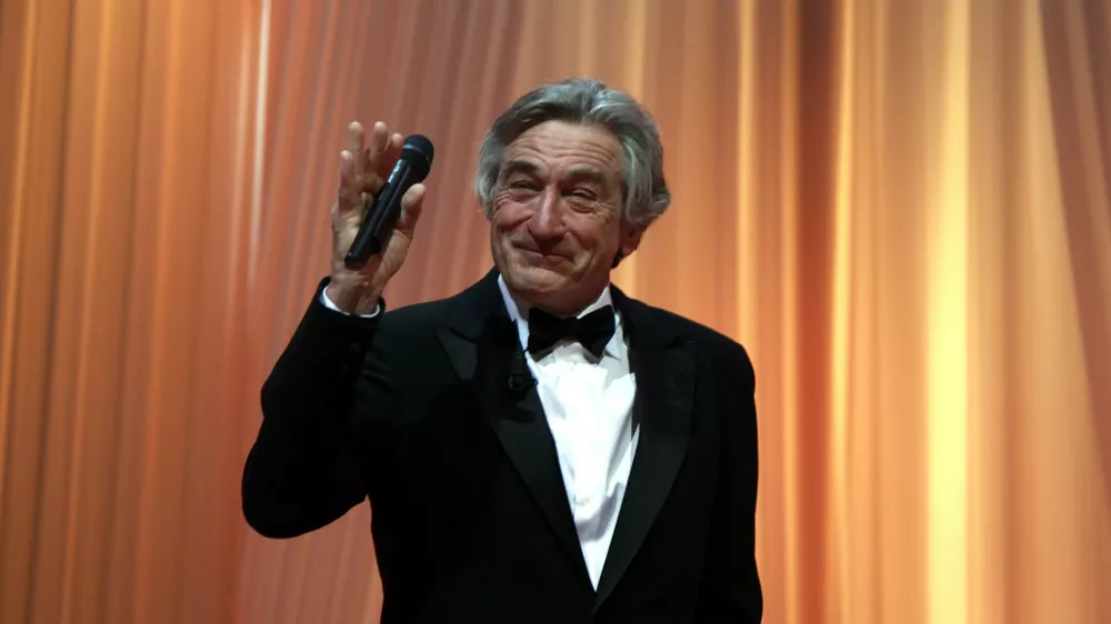 Jury president Robert De Niro gestures during the opening ceremony of the 64th Cannes Film Festival in Cannes May 11, 2011. Twenty films compete at the May 11 to 22 cinema showcase with an impressive roll call of major screen stars, revered "auteur" directors and relative newcomers. REUTERS/Eric Gaillard (FRANCE - Tags: ENTERTAINMENT)