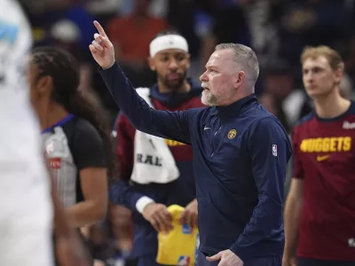 Denver Nuggets head coach Michael Malone directs his team against the Indiana Pacers in the second half of an NBA basketball game Sunday, April 6, 2025, in Denver. (AP Photo/David Zalubowski)