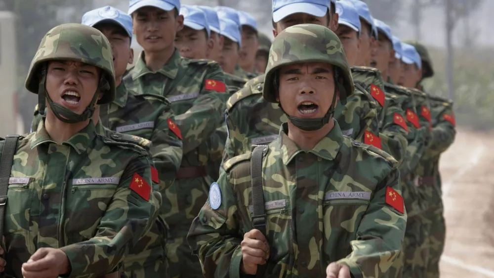 Chinese soldiers from an engineering unit practice at an army camp in Qinyang in Henan province September 15, 2007. The soldiers are a part of a 315-member multi-functional unit that will go for a United Nations peacekeeping mission in the Darfur region of Sudan in the near future. The peacekeeping mission will build and maintain barracks, roads, helipads and bridges, the army said. REUTERS/Reinhard Krause (CHINA)