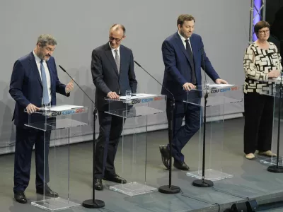 Markus Soeder, chairman of Bavarian&yen;s Christian Social Union party, Friedrich Merz, Christian Democratic Union party chairman and the Social Democratic Party co-leaders Lars Klingbeil and Saskia Esken, brief the media after reaching an agreement between their parties on a coalition for a new German government at a news conference in Berlin, Germany, Wednesday, April 9, 2025. (AP Photo/Markus Schreiber)