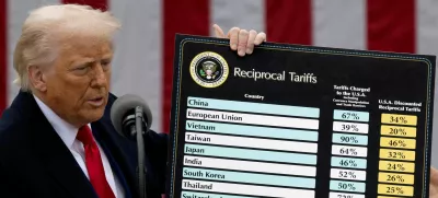 FILE PHOTO: U.S. President Donald Trump delivers remarks on tariffs at the White House in Washington, D.C., U.S., April 2, 2025. REUTERS/Carlos Barria/File Photo