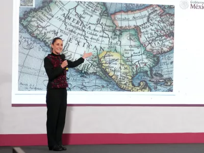 Mexico's President Claudia Sheinbaum shows a 1661 world map showing the Americas and the Gulf of Mexico in response to U.S. President-elect Donald Trump's comments about renaming the body of water, during a press conference at National Palace in Mexico City, Mexico, in this photo distributed on January 8, 2025. Presidencia de Mexico/Handout via REUTERS ATTENTION EDITORS - THIS IMAGE HAS BEEN SUPPLIED BY A THIRD PARTY. NO RESALES. NO ARCHIVES.