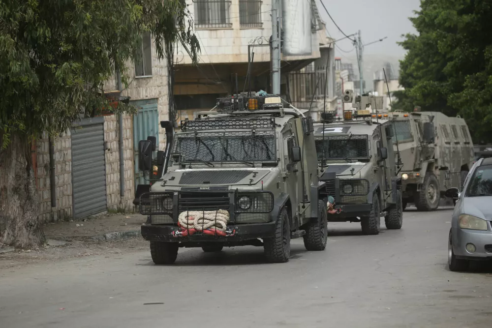 08 April 2025, Palestinian Territories, Nablus: Israeli army armoured vehicles moves along a road during a military operation in Nablus in the occupied West Bank. Photo: Mohammed Nasser/APA Images via ZUMA Press Wire/dpa