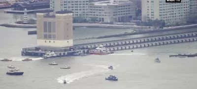 This aerial image taken from video shows rescue vessels on site of helicopter crash on the Hudson River in New York, Thursday, April 10, 2025. (WABC-TV via AP)