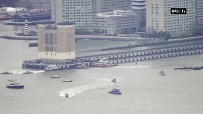 This aerial image taken from video shows rescue vessels on site of helicopter crash on the Hudson River in New York, Thursday, April 10, 2025. (WABC-TV via AP)