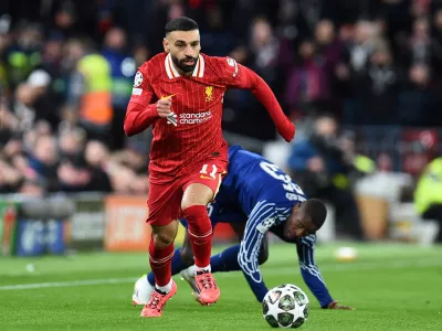 FILE PHOTO: Soccer Football - Champions League - Round of 16 - Second Leg - Liverpool v Paris St Germain - Anfield, Liverpool, Britain - March 11, 2025 Liverpool's Mohamed Salah in action with Paris St Germain's Nuno Mendes REUTERS/Peter Powell/File Photo