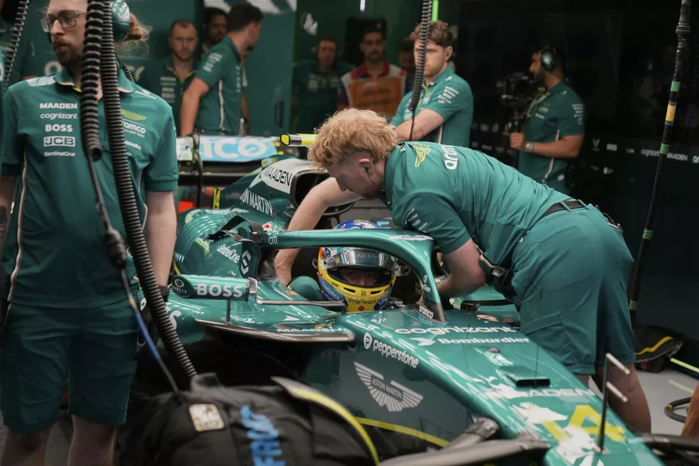 Aston Martin driver Fernando Alonso of Spain makes a pit stop during the second free practice for the Formula One 2025 Bahrain Grand Prix, in Sakhir, Friday, April 11, 2025. (AP Photo/Altaf Qadri)