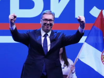 Serbia's President Aleksandar Vucic greets his supporters gathered during a huge rally in his support, apparently designed to counter student-led gatherings in Belgrade, Serbia, Saturday, April 12, 2025. (AP Photo/Darko Vojinovic)
