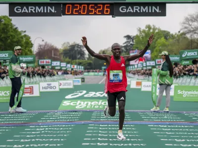 Benard Biwott of Kenya crosses the finish line to win the men's race of the Paris marathon, in Paris, Sunday, April 13, 2025. (AP Photo/Aurelien Morissard)