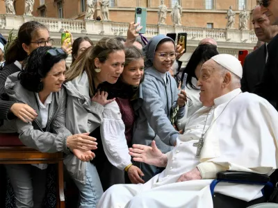 Pope Francis meets with people as he unexpectedly appears during the Palm Sunday Mass in Saint Peter's Square at the Vatican, April 13, 2024.  Vatican Media/&shy;Handout via REUTERS  ATTENTION EDITORS - THIS IMAGE WAS PROVIDED BY A THIRD PARTY.