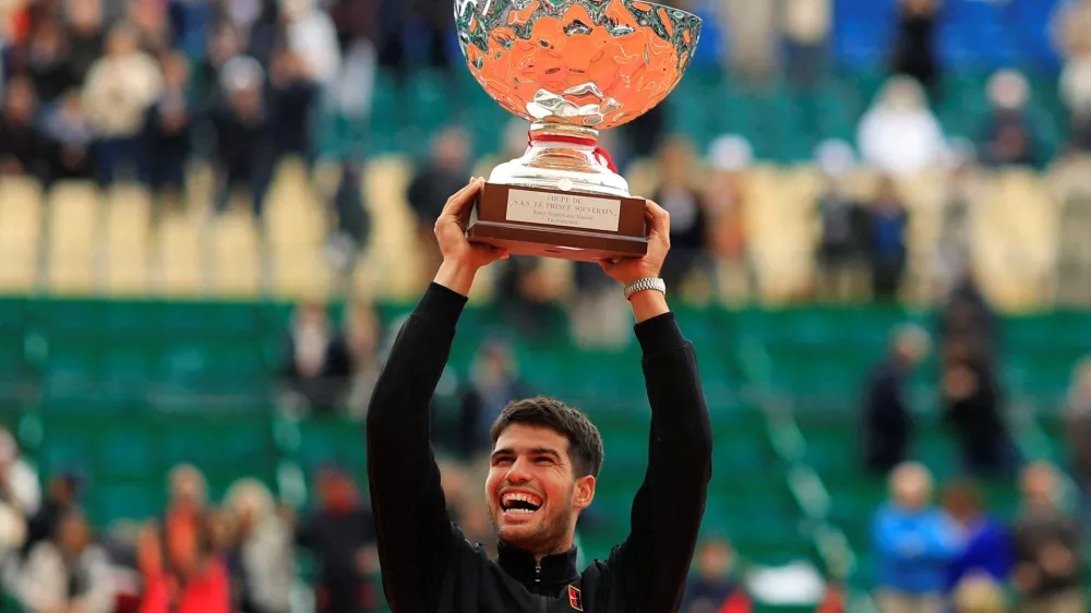 Tennis - ATP Masters 1000 - Monte Carlo Masters - Monte Carlo Country Club, Roquebrune-Cap-Martin, France - April 13, 2025 Spain's Carlos Alcaraz celebrates with the trophy after winning the Monte Carlo Masters REUTERS/Manon Cruz   TPX IMAGES OF THE DAY
