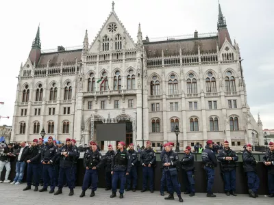 Police officers stand guard in front of the Parliament building, on the day the Hungarian Parliament votes on constitutional amendments targeting LGBTQ community, Budapest, Hungary, April 14, 2025. REUTERS/Bernadett Szabo