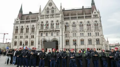 Police officers stand guard in front of the Parliament building, on the day the Hungarian Parliament votes on constitutional amendments targeting LGBTQ community, Budapest, Hungary, April 14, 2025. REUTERS/Bernadett Szabo