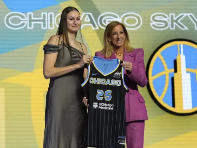 Ajsa Sivka, left, poses for a photo with WNBA commissioner Cathy Engelbert after being selected 10th overall by the Chicago Sky during the first round of the WNBA basketball draft, Monday, April 14, 2025, in New York. (AP Photo/Pamela Smith)