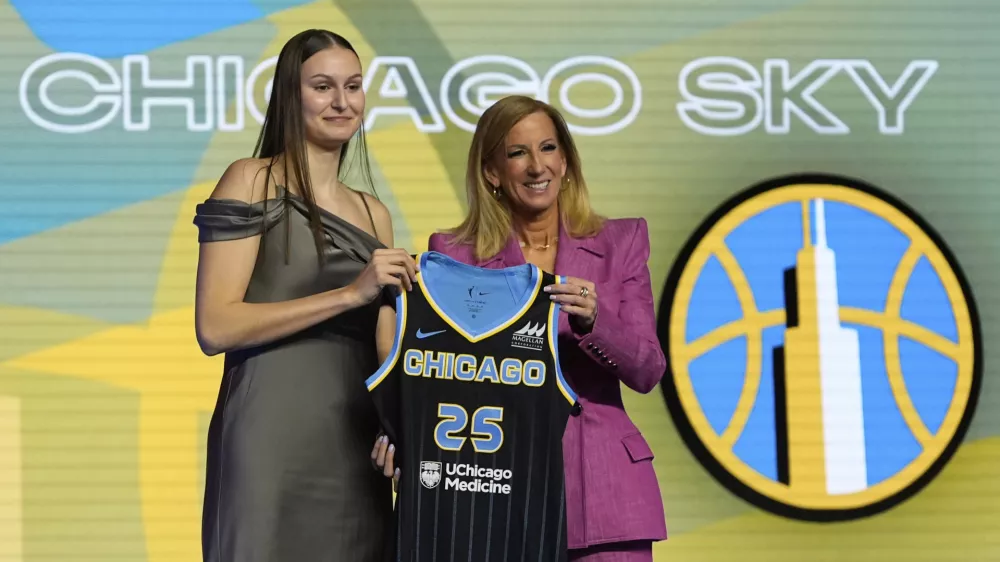 Ajsa Sivka, left, poses for a photo with WNBA commissioner Cathy Engelbert after being selected 10th overall by the Chicago Sky during the first round of the WNBA basketball draft, Monday, April 14, 2025, in New York. (AP Photo/Pamela Smith)