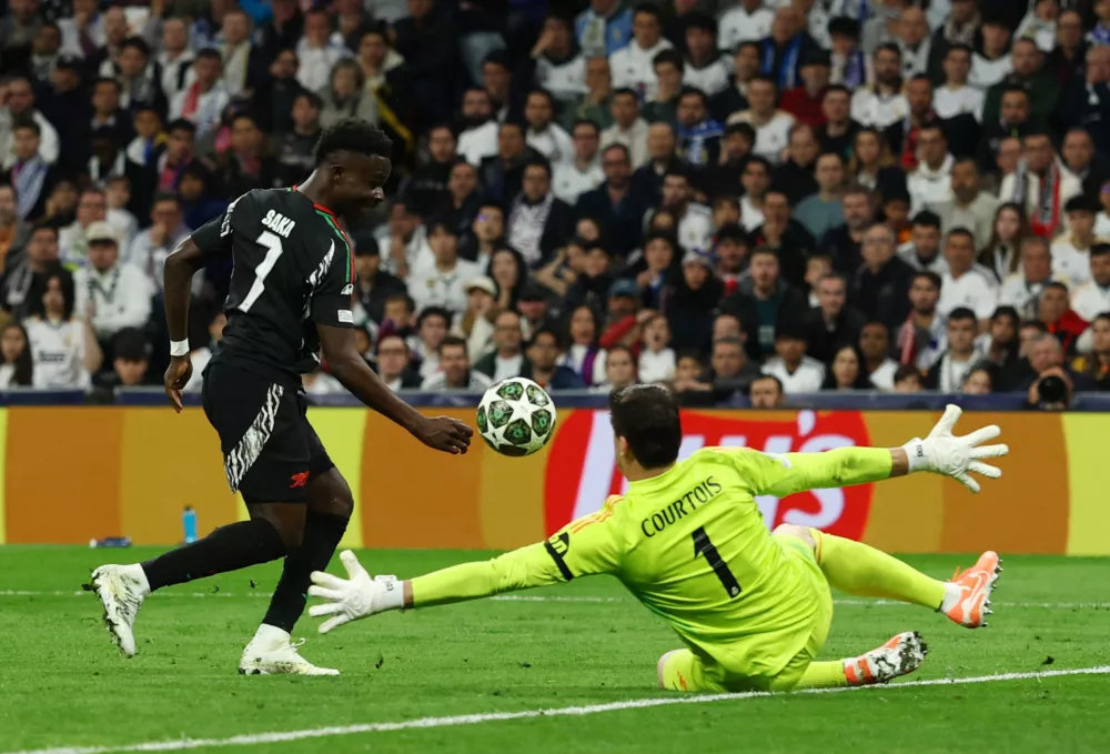 Soccer Football - Champions League - Quarter Final - Second Leg - Real Madrid v Arsenal - Santiago Bernabeu, Madrid, Spain - April 16, 2025 Arsenal's Bukayo Saka scores their first goal Action Images via Reuters/Lee Smith