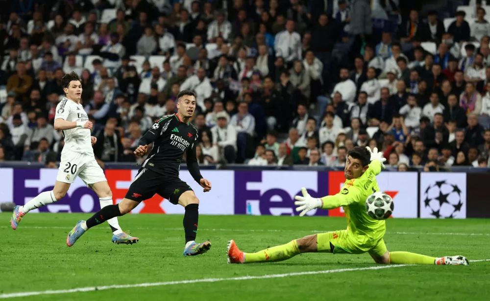 Soccer Football - Champions League - Quarter Final - Second Leg - Real Madrid v Arsenal - Santiago Bernabeu, Madrid, Spain - April 16, 2025 Arsenal's Gabriel Martinelli scores their second goal Action Images via Reuters/Lee Smith   TPX IMAGES OF THE DAY