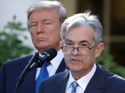 FILE PHOTO: U.S. President Donald Trump looks on as Jerome Powell, his nominee to become chairman of the U.S. Federal Reserve, speaks at the White House in Washington, U.S., November 2, 2017. REUTERS/Carlos Barria/File Photo