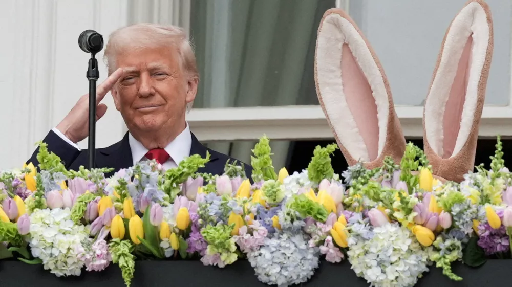 U.S. President Donald Trump salutes as he attends the annual White House Easter Egg Roll event, at the White House in Washington, D.C., U.S., April 21, 2025. REUTERS/Ken Cedeno   TPX IMAGES OF THE DAY