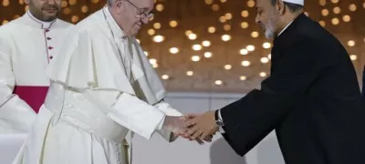 FILE - Pope Francis greets Sheikh Ahmed el-Tayeb, the grand imam of Egypt's Al-Azhar, after an Interreligious meeting at the Founder's Memorial in Abu Dhabi, United Arab Emirates, Wednesday, Feb. 4, 2015. (AP Photo/Andrew Medichini, file)