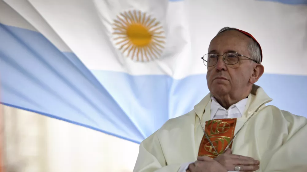FILE - In this Aug. 7, 2009 file photo, Argentina's Cardinal Jorge Bergoglio gives a Mass outside the San Cayetano church where an Argentine flag hangs behind in Buenos Aires, Argentina. (AP Photo/Natacha Pisarenko, file)