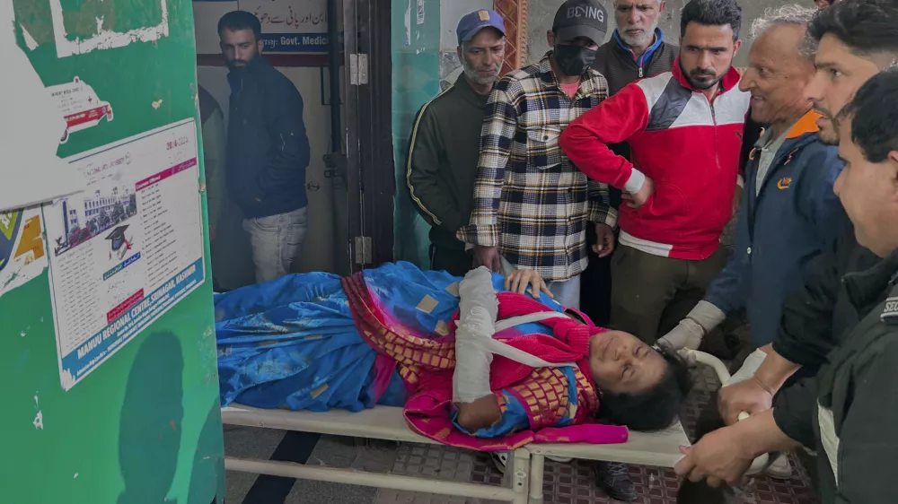 Paramedics carry a wounded tourist on a stretcher at a hospital in Anantnag after assailants indiscriminately fired at tourists visiting Pahalgam, Indian controlled Kashmir, Tuesday, April 22, 2025.(AP Photo/Dar Yasin)