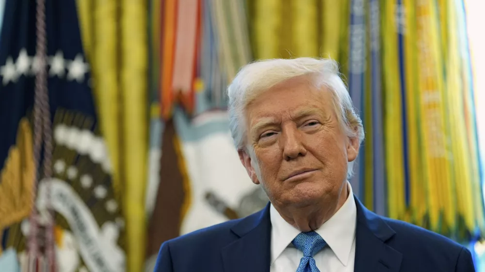 President Donald Trump watches as Treasury Secretary Scott Bessent participates in a ceremonial swearing in of Paul Atkins as chairman of the Securities and Exchange Commission, in the Oval Office of the White House, Tuesday, April 22, 2025, in Washington. (AP Photo/Alex Brandon)