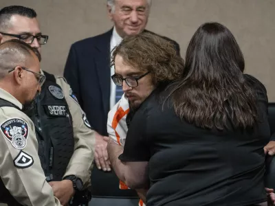 Adriana Zandri, widow of Ivan Manzano killed during the Walmart mass shooting, hugs defendant Patrick Crusius during a plea hearing in El Paso, Texas, Tuesday, April 22, 2025. (Omar Ornelas/Pool Photo via AP)