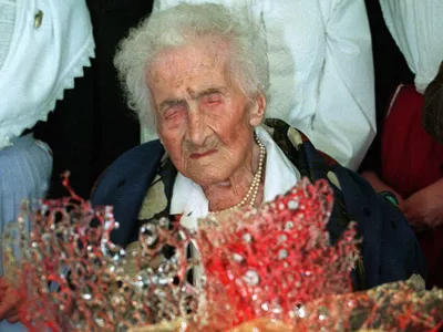 Jeanne Calment, believed to be the world's oldest person, receives a chocolate cake to celebrate her 122nd birthday in Arles, southern France Friday, Feb. 21, 1997. Two years ago, her doctor persuaded her to give up smoking, and she no longer indulges in the Sunday glass of Port wine. Calment has said olive oil is a key to her longevity. (AP Photo/Georges Gobet,Pool)