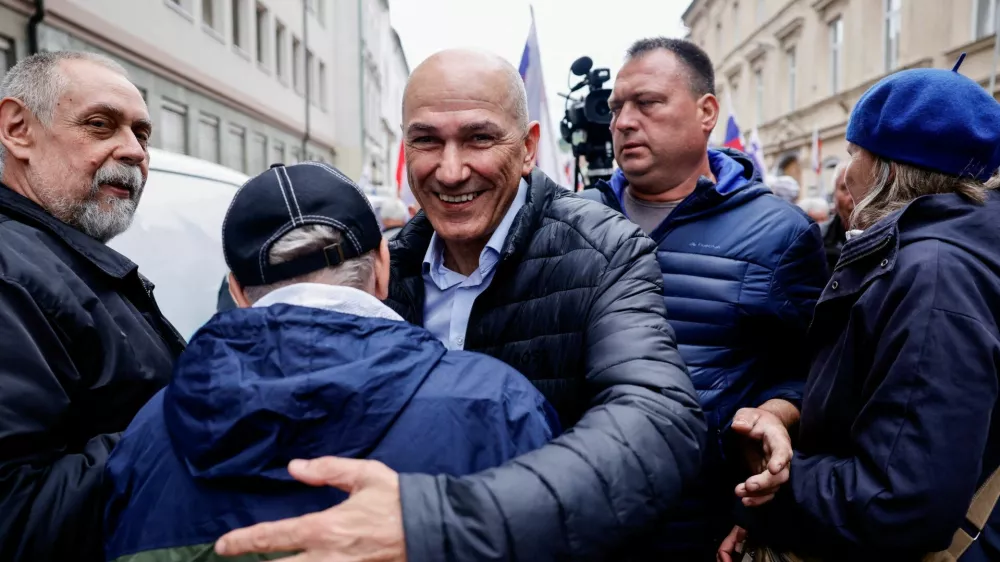Slovenia's former Prime Minister Janez Jansa greets a supporter after he is acquitted in corruption charges, in Celje, Slovenia April 18, 2025. REUTERS/Borut Zivulovic   TPX IMAGES OF THE DAY