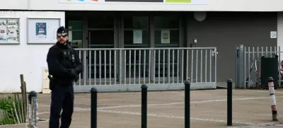 French police stands in front of the Notre-Dame-de-Toutes-Aides school after one high school student was killed and other students injured in a school stabbing, in Nantes, France, April 24, 2025. REUTERS/Stephane Mahe