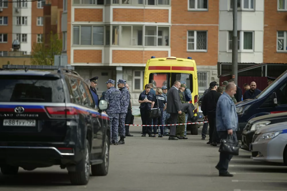 Police and investigators work at the scene where Lt. Gen. Yaroslav Moskalik, a deputy head of the main operational department in the General Staff of the Russian armed forces, was killed by an explosive device placed in his car in Balashikha, just outside Moscow, Russia, on Friday, April 25, 2025. (AP Photo)