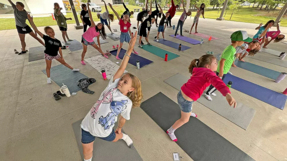 Children in the 2024 Art Exploration Summer Camp at the Mansfield Art Center participate in dance and musical lessons Tuesday morning. Each day, children create projects that combine artistic expression with scientific inquiry and technological innovation. The weeklong summer camps run through Aug. 9.