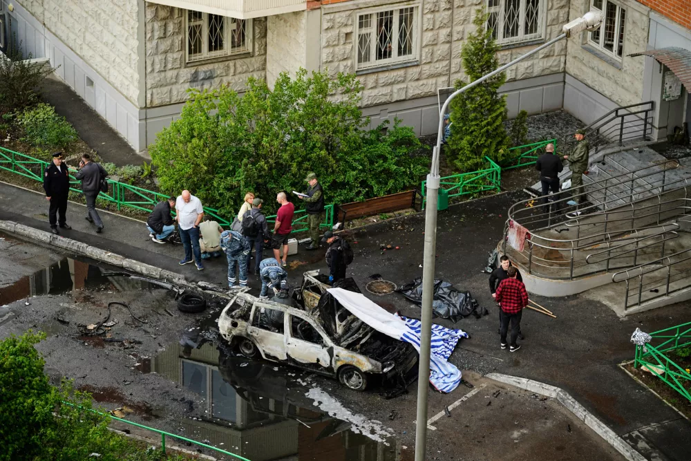 Investigators work the scene where Lt. Gen. Yaroslav Moskalik, a deputy head of the main operational department in the General Staff of the Russian armed forces, was killed by an explosive device placed in his car in Balashikha, just outside Moscow, Russia, on Friday, April 25, 2025. (AP Photo)