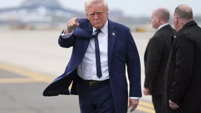 President Donald Trump points as he arrives at Newark Liberty International Airport in Newark, N.J., Saturday, April 26, 2025, upon returning from a trip to attend the funeral of Pope Francis at the Vatican. (AP Photo/Evan Vucci)