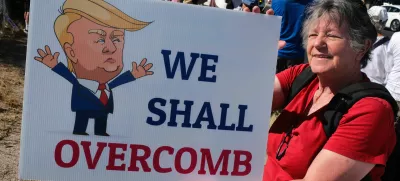 26 April 2025, US, Tucson: A woman holds a placard outside the Social Security Administration office in Tucson during a demonstration against possible cuts to the Social Security program in order the save money for US President Donald Trump's proposed tax cuts. Photo: Christopher Brown/ZUMA Press Wire/dpa