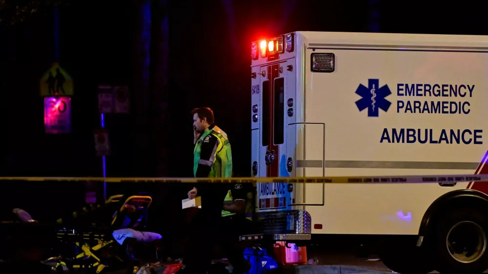 An ambulance is parked at the site of the Lapu Lapu day block party, where a vehicle drove into a crowd killing several people in Vancouver, British Columbia, Canada April 26, 2025. REUTERS/Jennifer Gauthier