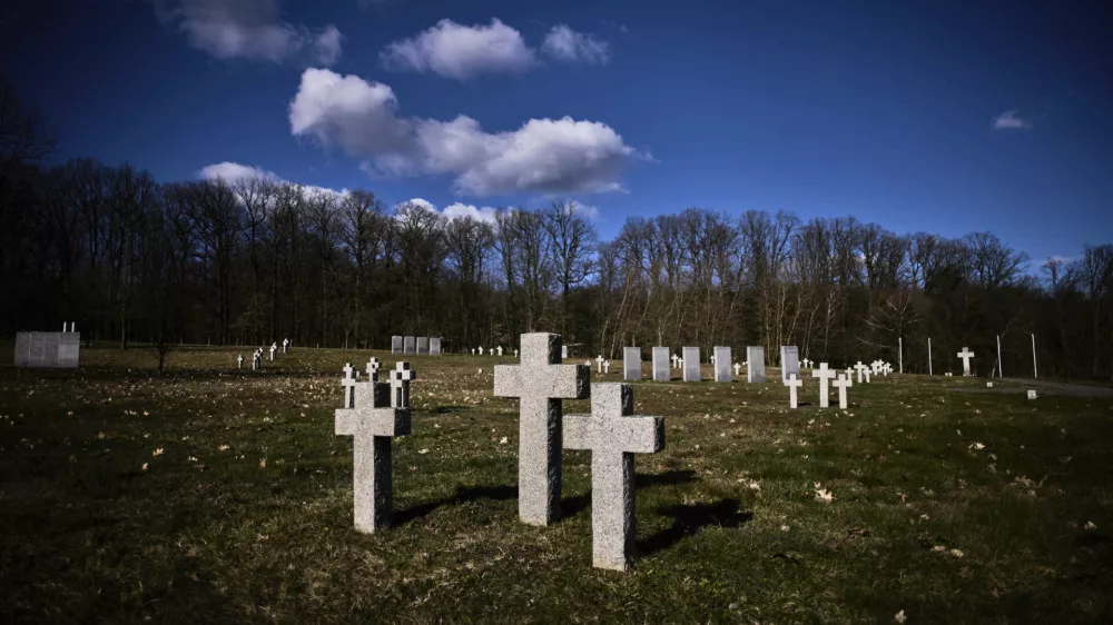 Crosses and grave stones stand on a war cemetery for more than 26.000 fallen German WWII soldiers in Stare Czarnowo, near Szczecin, Poland, Monday, March 17, 2025. (AP Photo/Markus Schreiber)