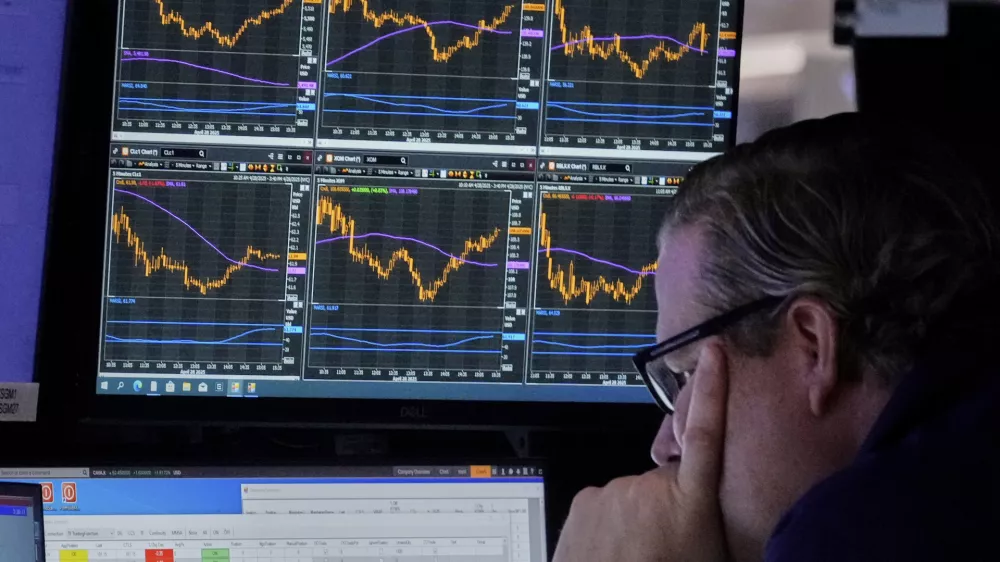 Specialist Gregg Maloney works at his post on the floor of the New York Stock Exchange, Monday, April 28, 2025. (AP Photo/Richard Drew)