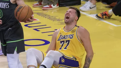 April 30, 2025, Los Angeles, California, USA: Luka Doncic #77 of the Los Angeles Lakers goes down hard as he clashes with Donte DiVincenzo #0 of the Minnesota Timberwolves goes to the basket during Round One Game Five of the 2025 NBA Playoffs on Wednesday April 30, 2025 at Crypto.com Arena in Los Angeles, California. JAVIER ROJAS/PI,Image: 994172760, License: Rights-managed, Restrictions:, Model Release: no