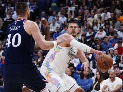 Apr 29, 2025; Denver, Colorado, USA; LA Clippers center Ivica Zubac (40) defends Denver Nuggets center Nikola Jokic (15) in the second half during game five of the first round for the 2025 NBA Playoffs at Ball Arena. Mandatory Credit: Ron Chenoy-Imagn Images