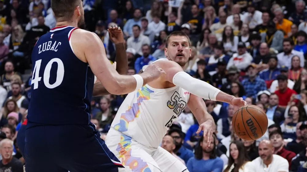 Apr 29, 2025; Denver, Colorado, USA; LA Clippers center Ivica Zubac (40) defends Denver Nuggets center Nikola Jokic (15) in the second half during game five of the first round for the 2025 NBA Playoffs at Ball Arena. Mandatory Credit: Ron Chenoy-Imagn Images