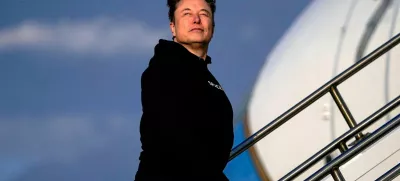 Tesla CEO Elon Musk boards Air Force One with U.S. President Donald Trump (not pictured) as they depart for Philadelphia, Pennsylvania, from Morristown Municipal Airport in Morristown, New Jersey, U.S., March 22, 2025. REUTERS/Nathan Howard