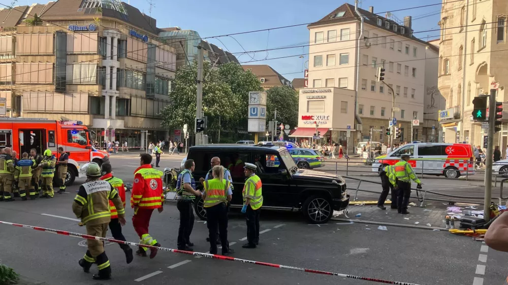 02 May 2025, Baden-W&uuml;rttemberg, Stuttgart: Police officers and emergency workers present at the scene where a car drove into people. According to police, a car has driven into a group of people in Stuttgart city center. Three people have been injured so far. The driver has been arrested, a police spokeswoman said. Photo: Marco Krefting/dpa